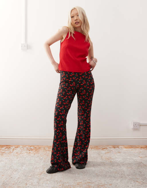 Noisy May Petite flare pants in black cherry print ASOS