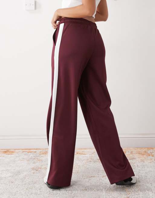 Noisy May straight leg jersey pants in burgundy with white side