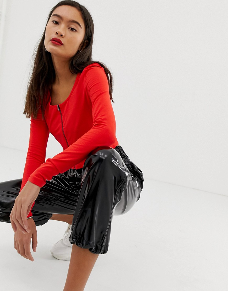 Noisy May zip through cropped top-Red