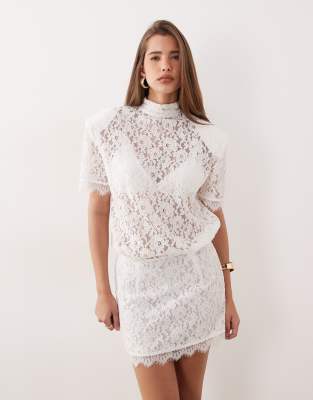 Noughts & Kisses Noughts & Kisses lace high neck padded shoulder mini dress in white