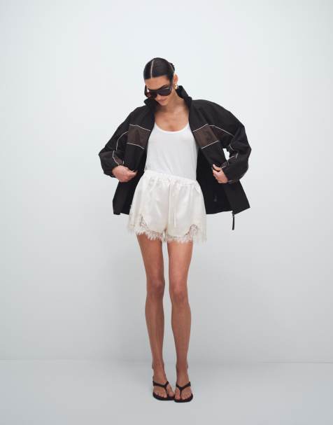 Noughts & Kisses lace trim tie waist satin shorts in cream