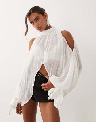 Noughts & Kisses plisse high neck wide cape sleeve tie detail cropped blouse in 
