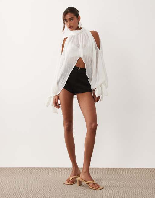 Noughts & Kisses plisse high neck wide cape sleeve tie detail