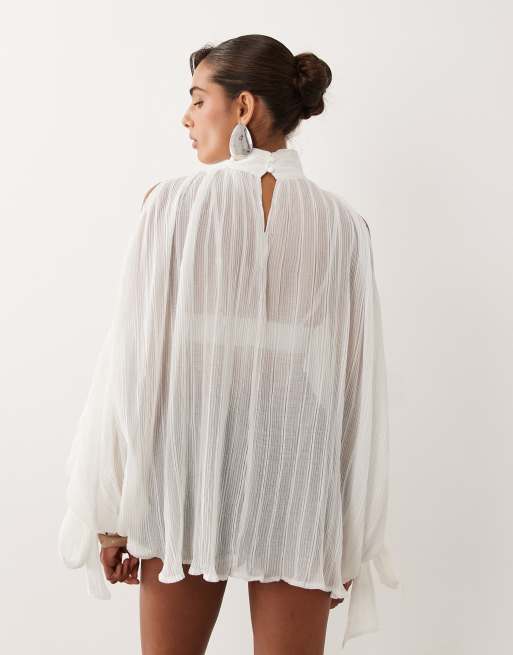 Noughts & Kisses plisse high neck wide cape sleeve tie detail