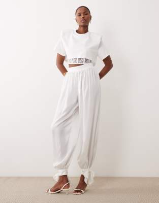 Noughts & Kisses Noughts & Kisses satin balloon leg tie detail trouser co-ord in white