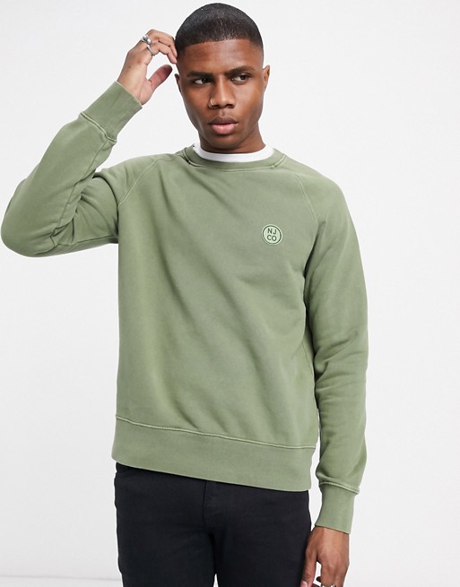 Nudie Jeans Co Melvin circle logo crew neck sweat in green
