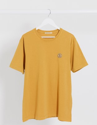 mustard shirt and jeans