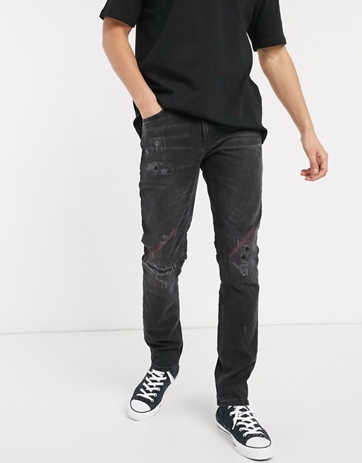 Nudie Jeans Lean Dean slim tapered fit rip and repair jeans in stitch and paint