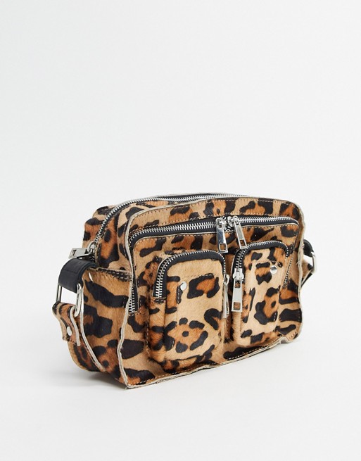 Nunoo Ellie cross body bag with front pockets in leopard faux pony