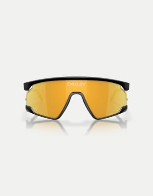 Oakley - BXTR - Lunettes de soleil masque en métal avec verres réfléchissants dorés - Noir mat