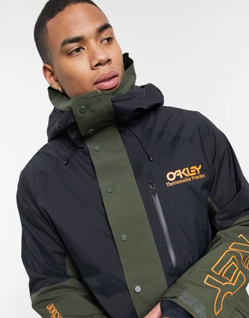 Oakley TNP lined shell ski anorak jacket in black/green | ASOS