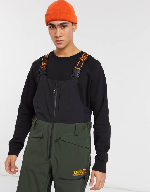 Oakley TNP shell ski bib dungarees in black/green | ASOS