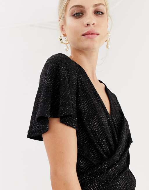 https://images.asos-media.com/products/oasis-glitter-jumpsuit-with-twist-front-in-black/10773800-3?$n_640w$&wid=513&fit=constrain