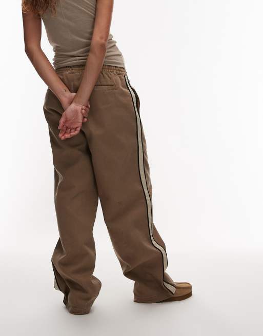 Obey – Astrid – Bruna, baggy byxor i dra på-modell med beige sidorand, 3 av 5