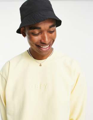 be the light yellow sweatshirt