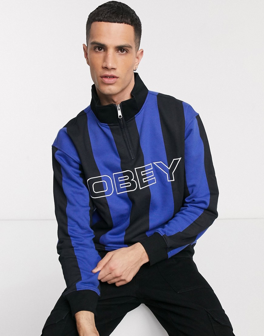 Obey – Goal – Svart- och blårandig sweatshirt med dragkedja i halsen