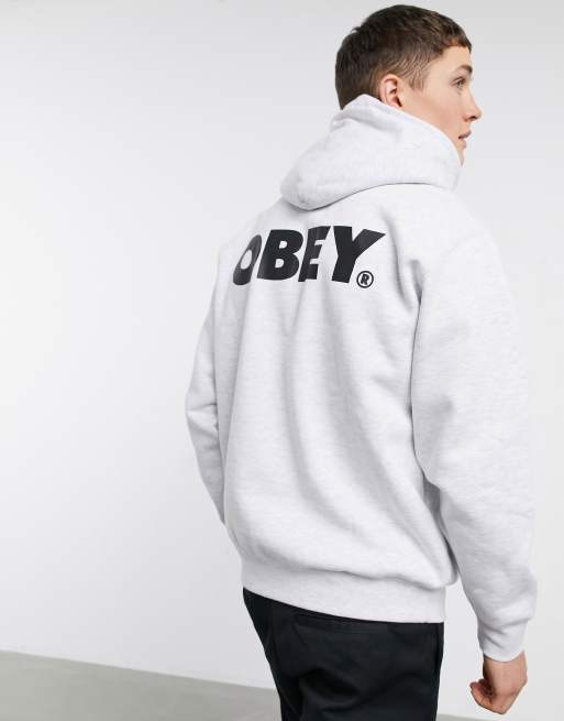 Obey – Grå huvtröja med stort tryck baktill