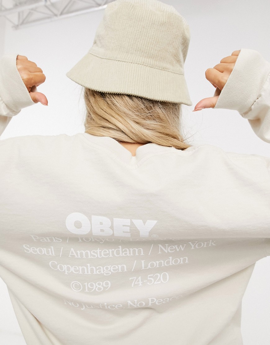 Obey – Långärmad avslappnad t-shirt med 'No justice No Peace'-tryck baktill-Krämvit