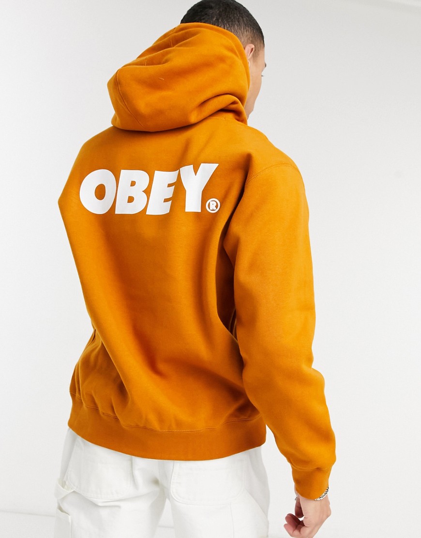 Obey – Orange huvtröja med stort tryck baktill-Brun