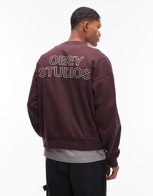Obey Obey studios faded boxy sweatshirt with back print in burgundy-Red