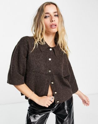 Object button through knitted top in brown
