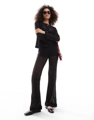 open knit flared pants in black - part of a set