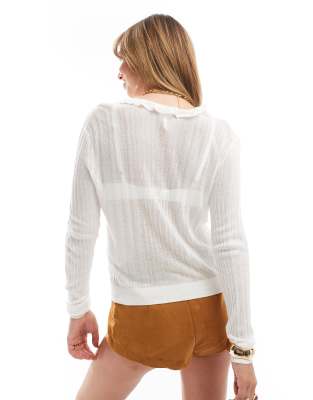 ruffle front long sleeve knit cardigan in white