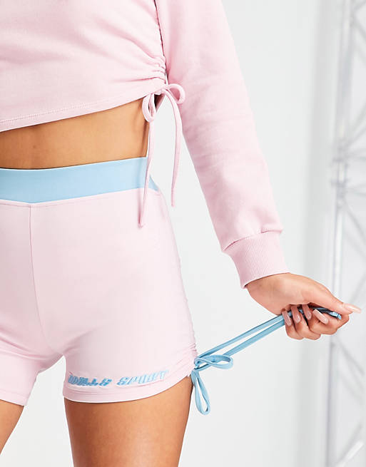 ODolls Collection sportswear motif ruched side booty shorts in pink