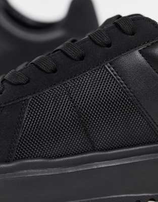 black nike trainers office