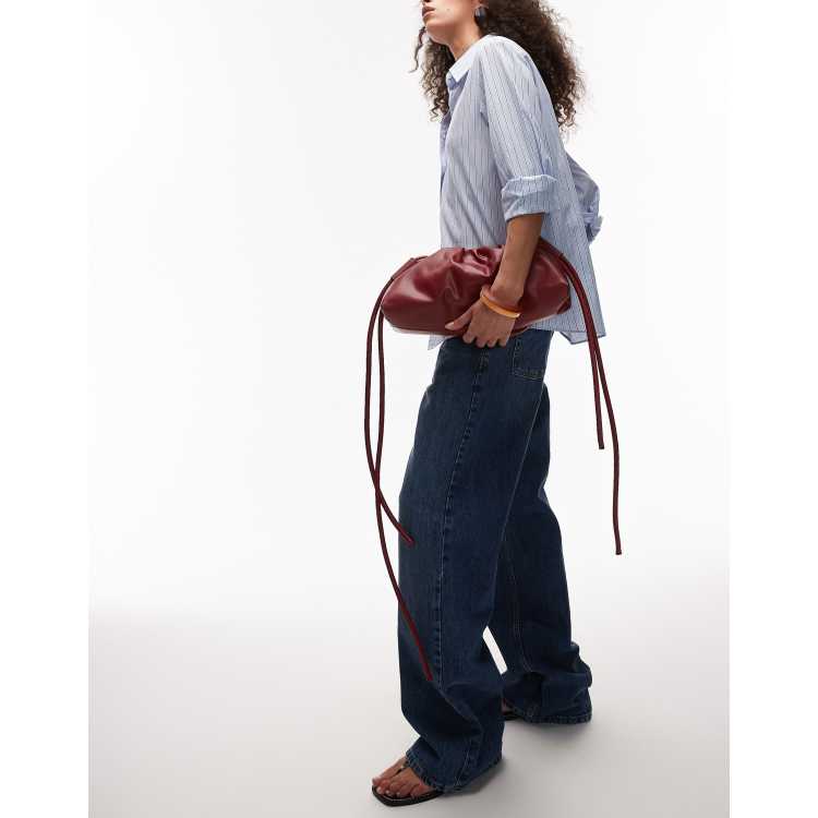 OLEND Dumpling elongated shoulder bag in cherry red | ASOS