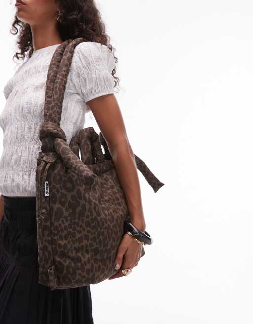 ÖLEND - Ona - Sac bandoulière multipositions en nylon souple à imprimé léopard 