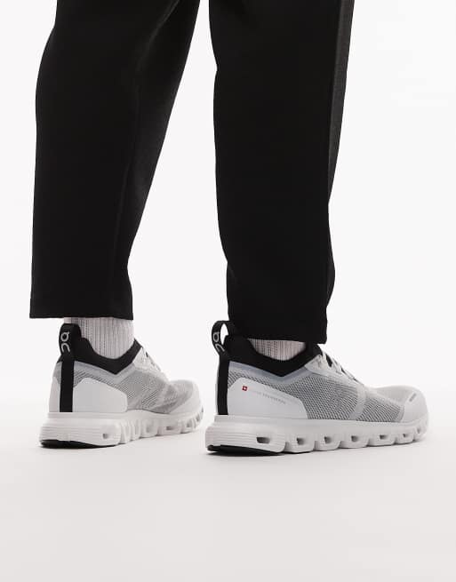 ON Cloud 6 versa all day trainers in white and black, 4 of 5