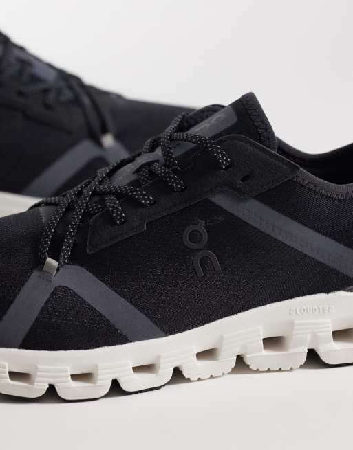 ON Cloud X 4 AD training trainers in black and white, 3 of 5