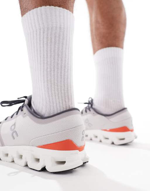 ON Cloud X 4 training trainers in grey and red, 4 of 5