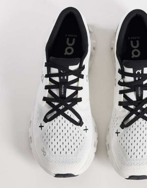 ON Cloud X 4 training trainers in white and black, 2 of 5