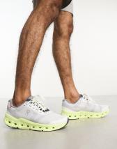 ON Cloudgo running trainers in white and green