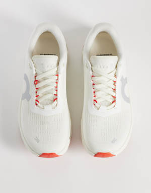 ON Cloudmonster 1 running trainers in white and green