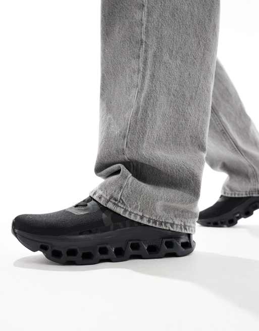 ON Cloudmonster running trainers in all black