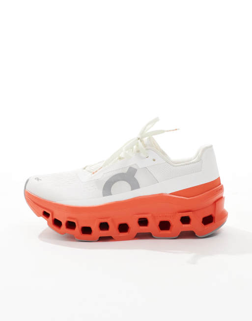 ON Cloudmonster running trainers in white and red, 2 of 5