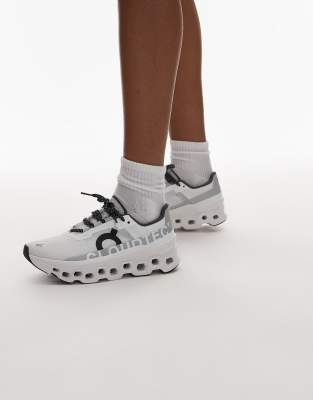 ON Cloudmonster running trainers in white