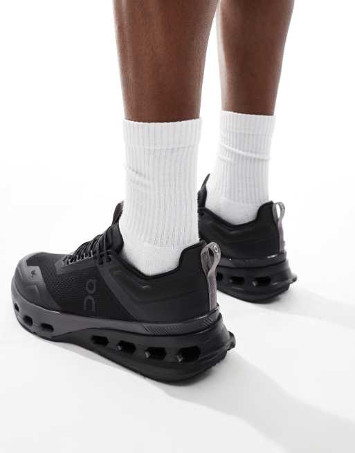 ON Cloudnova X training trainers in triple black ASOS