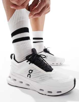 ON Cloudnova X training trainers in white and black