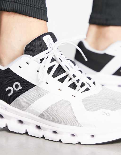 ON Cloudrunner trainers in black and white, 3 of 4