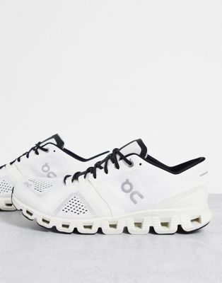 On Running Cloud X trainers in white and black