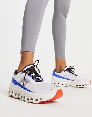 ON Cloudmonster trainers in white and cobalt