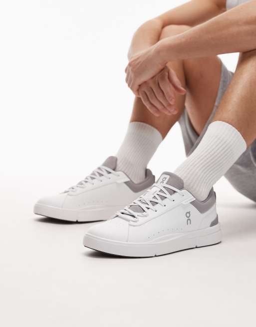 ON The Roger Advantage trainers in white and black