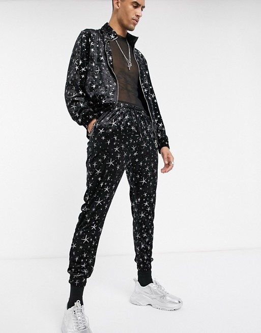 One Above Another stars velour track pant in black