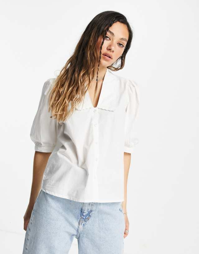 Only blouse with low neck and broderie detail in white