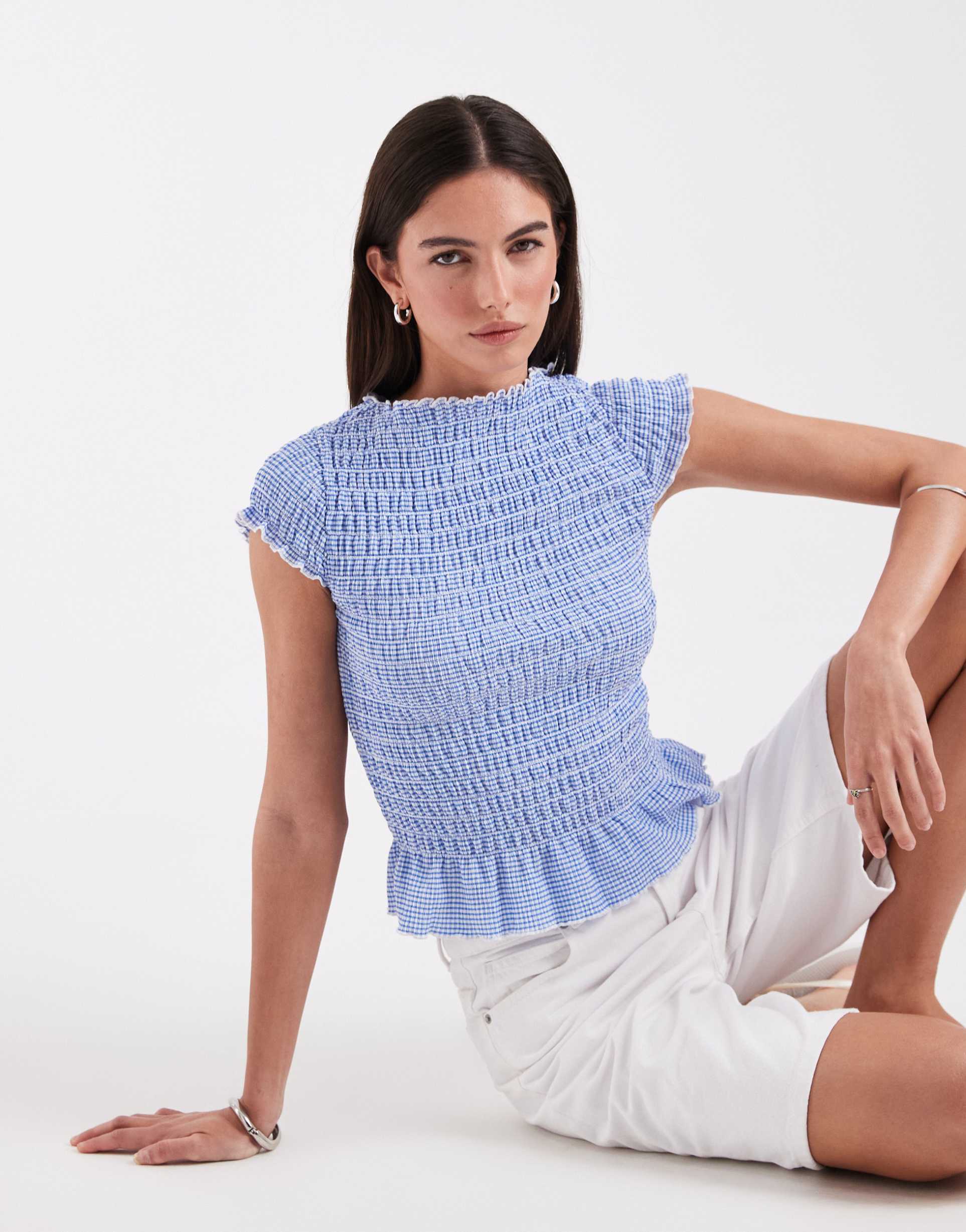 only cap sleeve top with ruffle trim in blue gingham