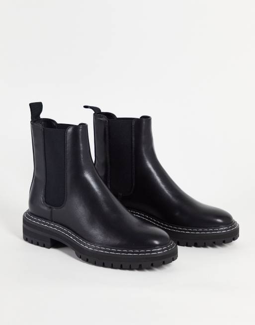 Black boots on sale with white stitching